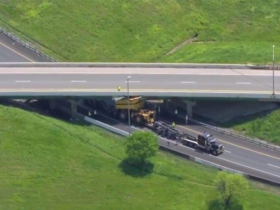 Truck under bridge